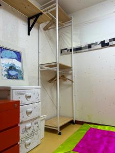 a bedroom with bunk beds and a rug at Eugene Hanok Stay in Seoul