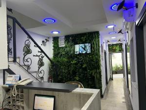 a hallway with a green wall in a building at Tiana Butik Otel in Bodrum City