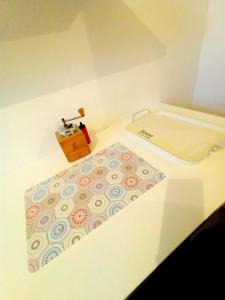 a white room with a bath tub and a sink at The heart of Sarajevo Apartment in Sarajevo