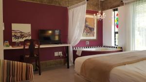 Postel nebo postele na pokoji v ubytování Absolute Castillo + 25 fotografií