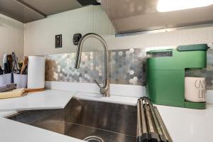 a kitchen with a sink and a faucet at Waterfront Getaway, Dock Your Boat & Play! in Edgewater +33 photos
