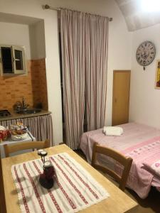 Postel nebo postele na pokoji v ubytování Petali Rosa - Dimora Pietra