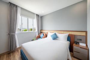 Tempat tidur dalam kamar di Tahiti Central Hotel