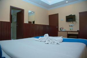 Postel nebo postele na pokoji v ubytování Taj Residency Pokhara