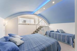 Postel nebo postele na pokoji v ubytování Le Rondinelle Rooms + 37 fotografií
