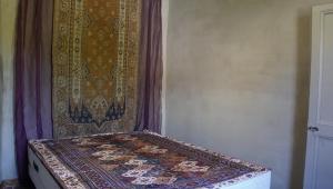 a corner of a room with a rug on the wall at River House in medieval bastide - Sleeps up to 6 in Chalabre