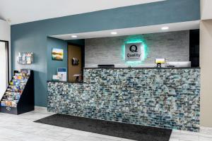 a lobby of a quality store with a tile counter at Quality Inn in Carrollton