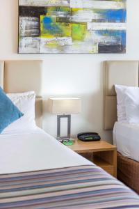 Postel nebo postele na pokoji v ubytování Rydges Esplanade Resort Cairns