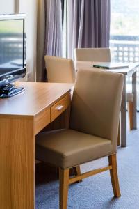 TV a/nebo společenská místnost v ubytování Rydges Esplanade Resort Cairns