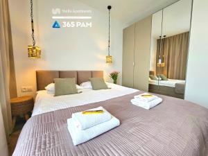 Giường trong phòng chung tại Apartament Nefryt - 365PAM