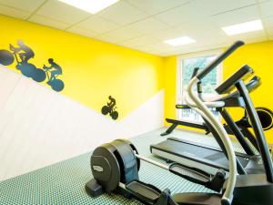 a gym with a bike mural on the wall at Ibis Styles Sallanches Pays du Mont-Blanc in Sallanches