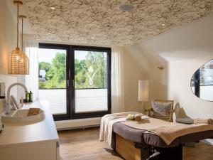 Ein Bett oder Betten in einem Zimmer der Unterkunft Hotel Schnitterhof