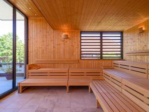 an empty room with benches in a wooden building at Hotel Schnitterhof in Bad Sassendorf