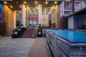 a swimming pool in the middle of a building at Tahiti Central Seaview - 50m to Night Market Phu Quoc in Phú Quốc