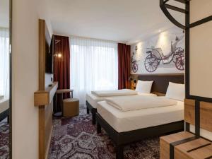 Postel nebo postele na pokoji v ubytování ibis Styles Coburg