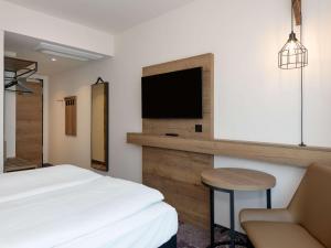 TV a/nebo společenská místnost v ubytování ibis Styles Coburg