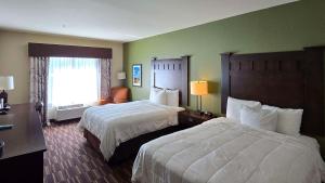 Postel nebo postele na pokoji v ubytování Comfort Inn & Suites