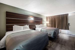 Ένα ή περισσότερα κρεβάτια σε δωμάτιο στο Quality Inn +22 φωτογραφίες