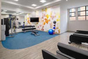 a gym with exercise equipment and a tv at Hyatt Place Nashville/Green Hills in Nashville