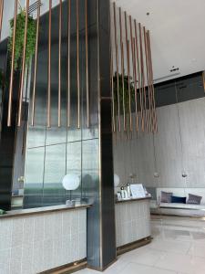 a lobby with a large glass wall withngthngthngthngthngthngth at Private 1 Bedroom at Niche Mono Mega Space Bangna in Bangna