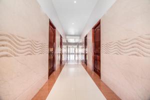 a corridor of an office building with a long hallway at FabHotel Krishna Residency in Chennai