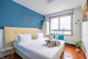 A bed or beds in a room at Camplus Lambrate Casa per Ferie