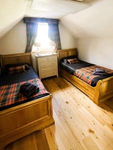 Postel nebo postele na pokoji v ubytování Clarinnes Cottage