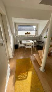 a dining room with a table and a window at Apartment über 2 Etagen nahe Messe und Stadion in Dortmund