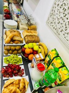 a table with many different types of food on it at Casa Birmula Boutique Hotel in Cospicua