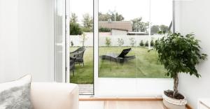 a living room with a large sliding glass door at Kanali Villa in Pärnu