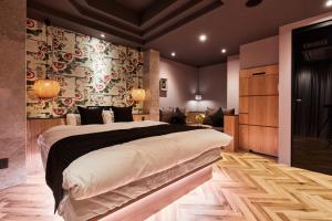 a bedroom with a large bed in a room at M4 design hotel in Tokyo