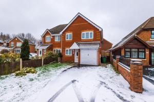 a house with snow on the driveway in front of it at 3 Bed+2 Bath Perfect Contractors & Groups in Ocker Hill