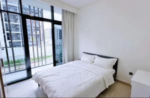 Voodi või voodid majutusasutuse Business Bay Stylish Apartment In Dubai toas