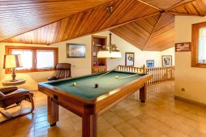 a room with a pool table in a house at Picturesque Costa Brava Countryside Villa in Les Planes d'Hostoles