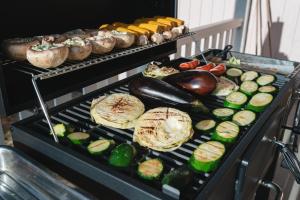 a grill with different types of vegetables on it at Olo Center by Kolovesi Nature Park in Enonkoski