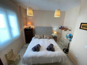 A bed or beds in a room at MAGNÍFICO ÁTICO PLENO CENTRO. Terraza 60m. Climatizado, Garaje