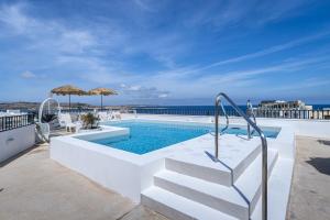 a swimming pool with a stairway leading to a swimming poolvisorvisor at Park Lane Boutique Aparthotel in St. Paul's Bay