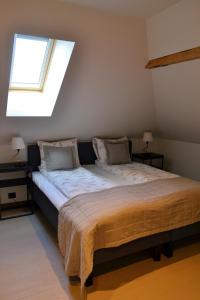 Postel nebo postele na pokoji v ubytování Andenes Suitehotel