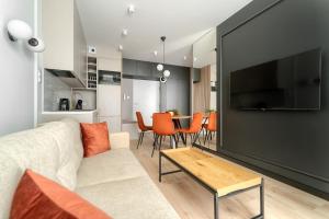 TV a/nebo společenská místnost v ubytování MARGI Jolly BEAUTI LUX Apartament