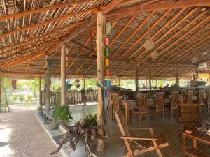 a pavilion with chairs and tables in a restaurant at Kitelantis Hotel and Resort in Kalpitiya