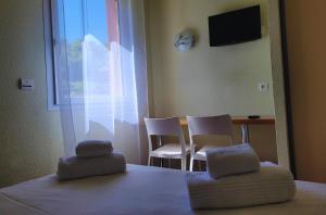 Postel nebo postele na pokoji v ubytování Hotel Restaurant Les Chataigniers