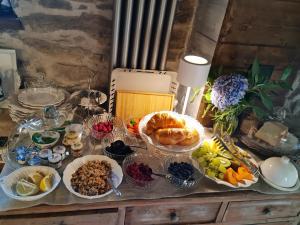 a table with many plates of food on it at Il Meriggio in Mezzenile