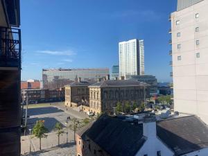 a view of a city with tall buildings at 2br Spacious City Centre Apartment in Belfast
