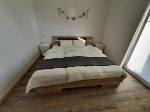 Apartment AlpiPond客房内的一张或多张床位