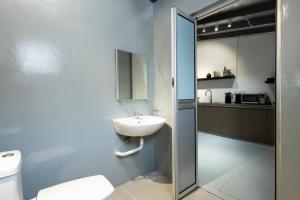 a bathroom with a sink and a toilet and a shower at Mono Ipoh - Bercham, 2 parking, sleep 10, Lost World Tambun in Ipoh +26 photos