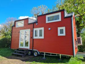 a red tiny house on a trailer at Red Tiny House in Sopot