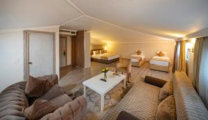 a living room with a couch and a table at Orya Hotel in Istanbul +42 photos