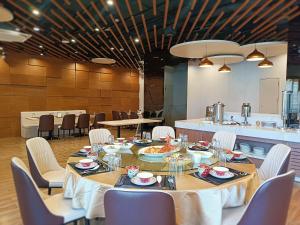 a dining room with a long table and chairs at Escale International Hotel in Djibouti