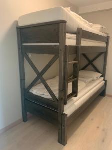 a wooden bunk bed in a room at Folkestadvegen 23Q in Bø