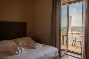 Кровать или кровати в номере La Sommità Relais & Chateaux